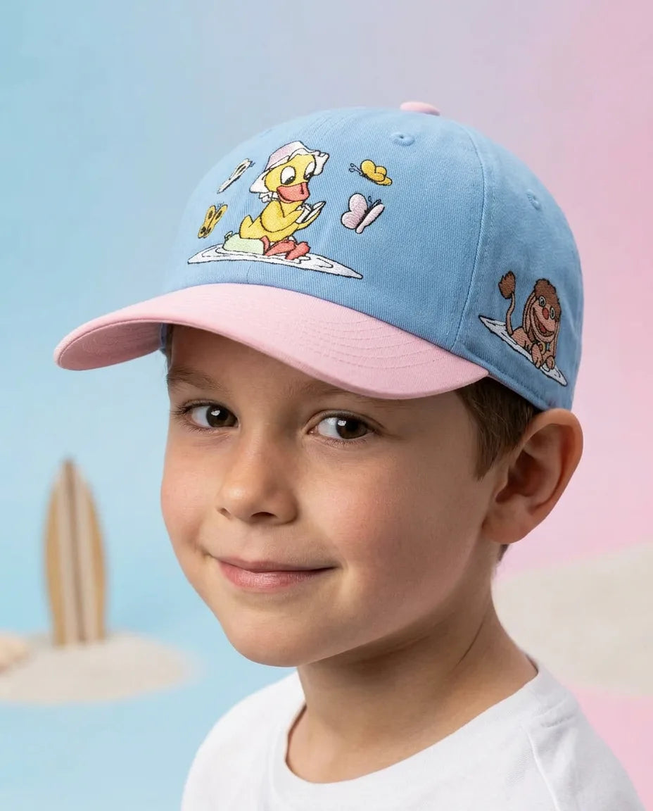 koaa – Notre marchand de sable « Schnatterinchen Badespaß » – Casquette polo bleu/rose